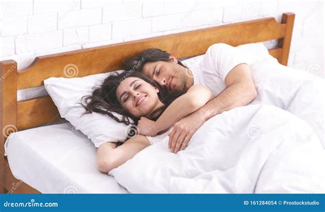 man and lady in bed